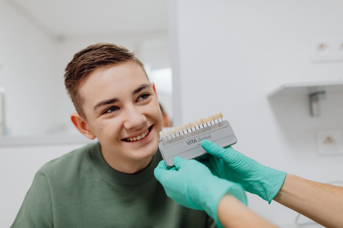 Dentist matching tooth shades with a whitening shade guide